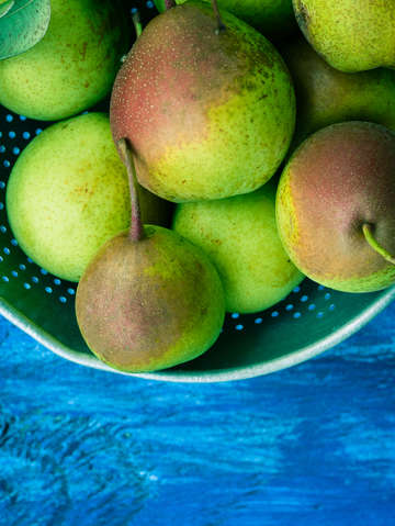 Pears on a blue table