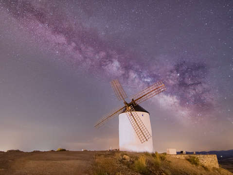 Milky way over traditional windmills