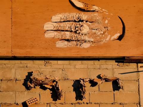 Hand and bricks 1