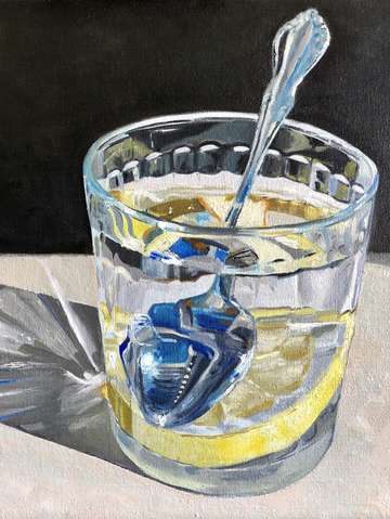 Lemon slice in water with spoon