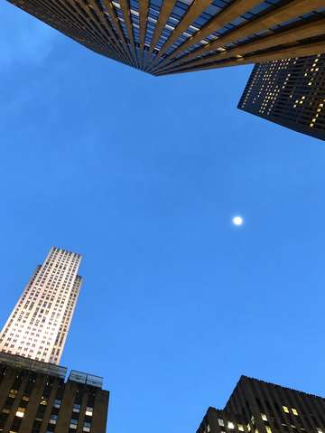 Skyscraper and a moon manhattan new york