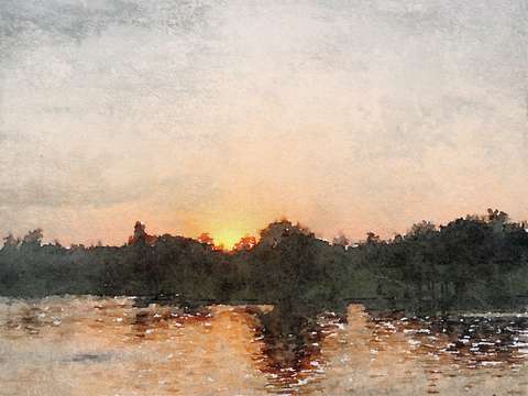 Golden sunrise over water
