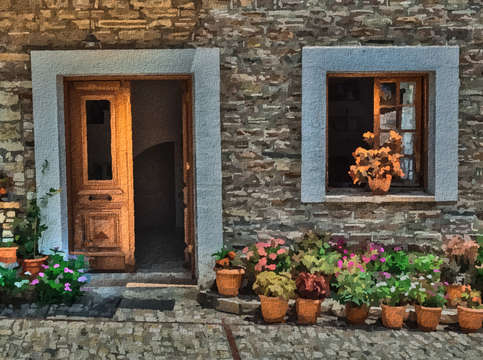 Stone house with flowerpots