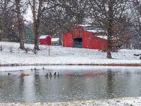 Red barn in snow painterly