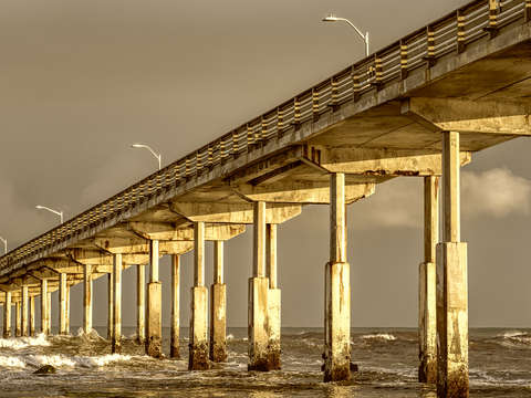 Golden columns in ocean beach