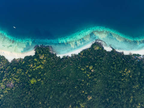 Aerial view of tropical island beach and coral r 2