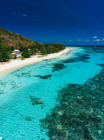 Aerial view of tropical island beach and coral r 4