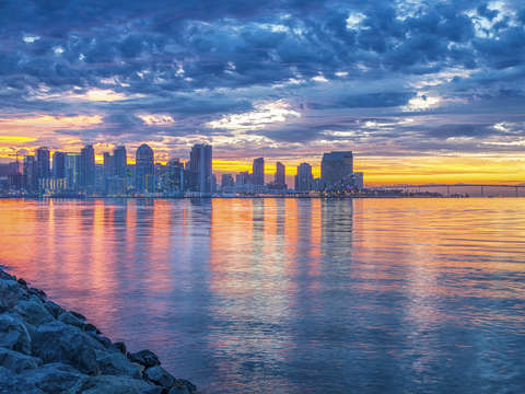 A sunrise skyline reflection