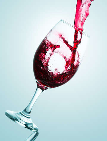 Pouring of red wine