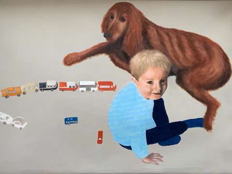 Boy with toys and dog