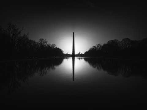 Equinox sunrise at the washington monument in blac