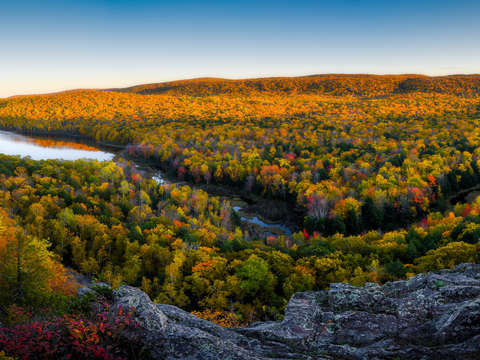 Autumn sunset at lake in the clouds