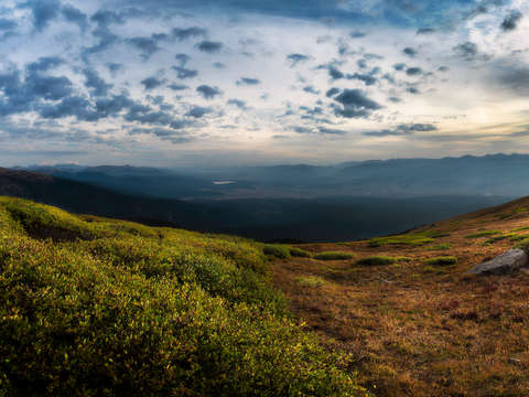 Green and gold mountain lanscape at dawn