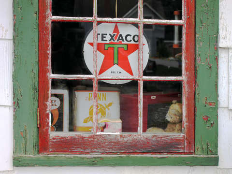 Stuck in time an old texaco sign adorns a window i