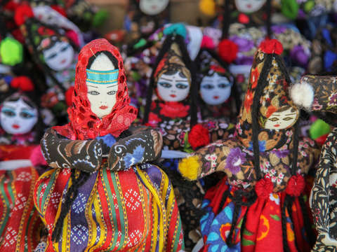 Dolls with woven costumes