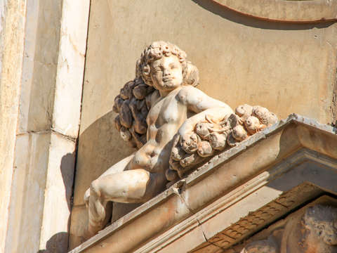 Statue on portico madrid