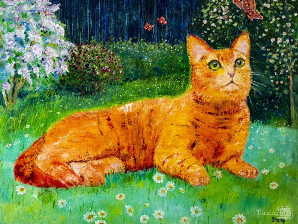 Ginger cat in spring garden