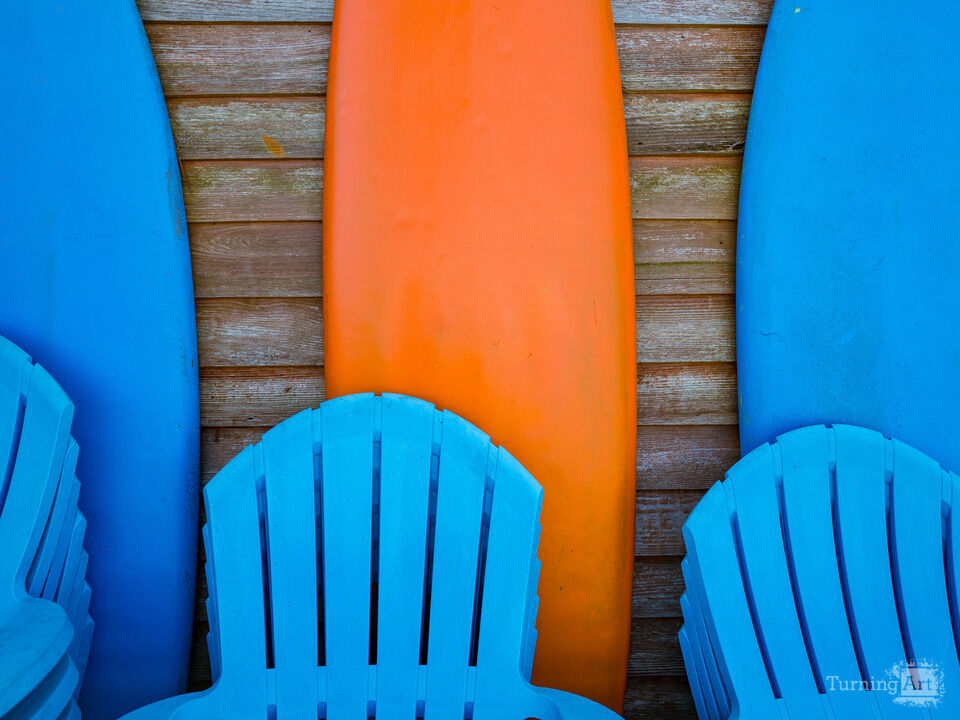 Colorful Surfboards against a weathered Wood Wall