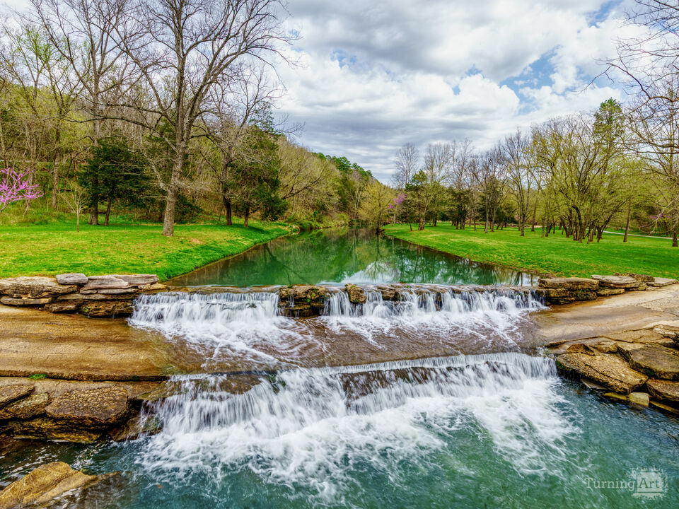 Lampe Waterfalls Over A Road