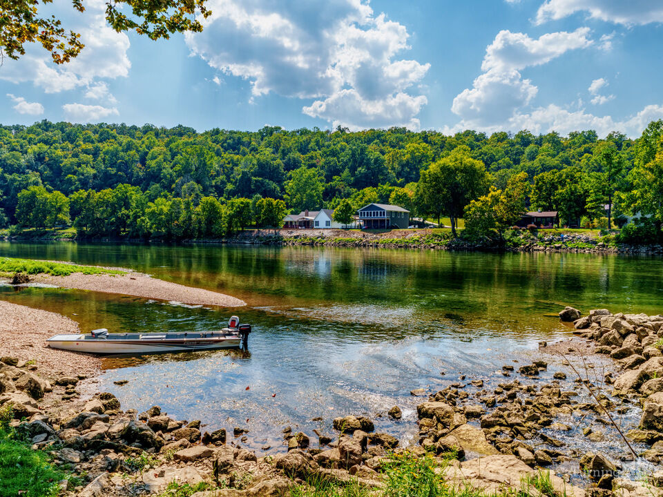 Fishing Boat On White River Shoreline