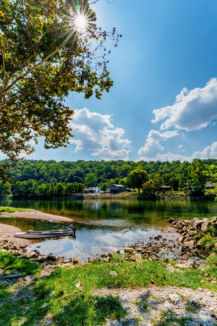Fishing Boat On White River Shoreline