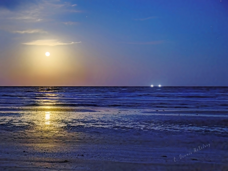 Shrimpers fishing under full moon