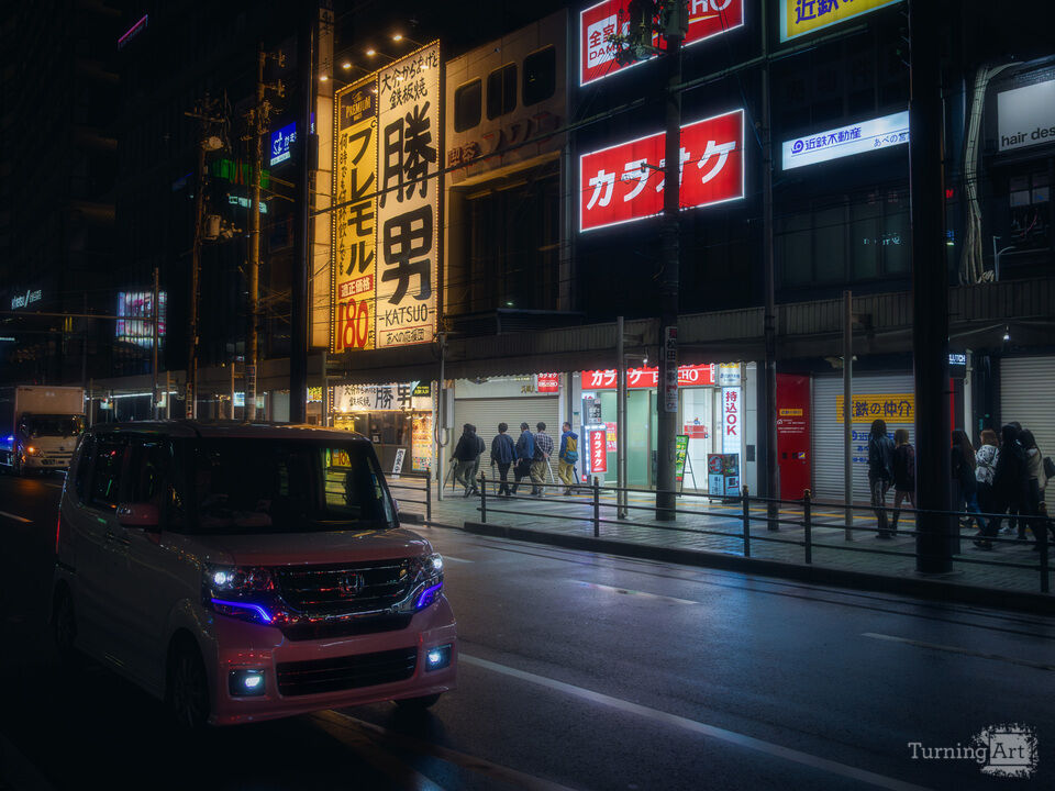 City lights, Osaka unfolds in silence.