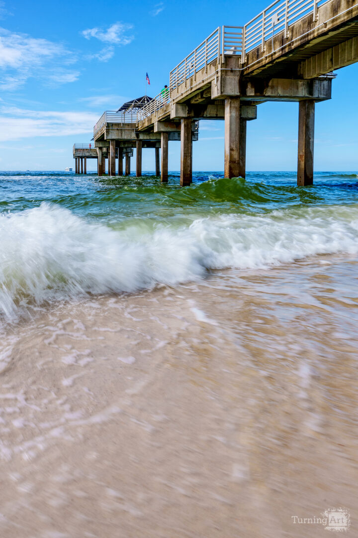 Orange Beach Pier Splashing Waves