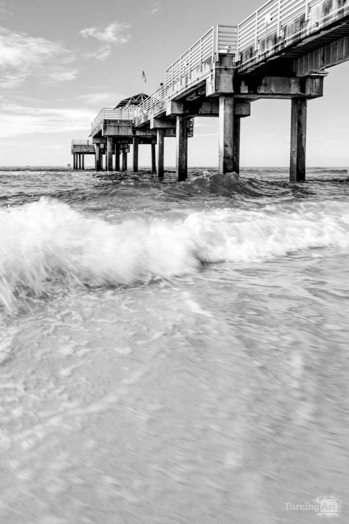 Orange Beach Pier Splashing Waves Grayscale