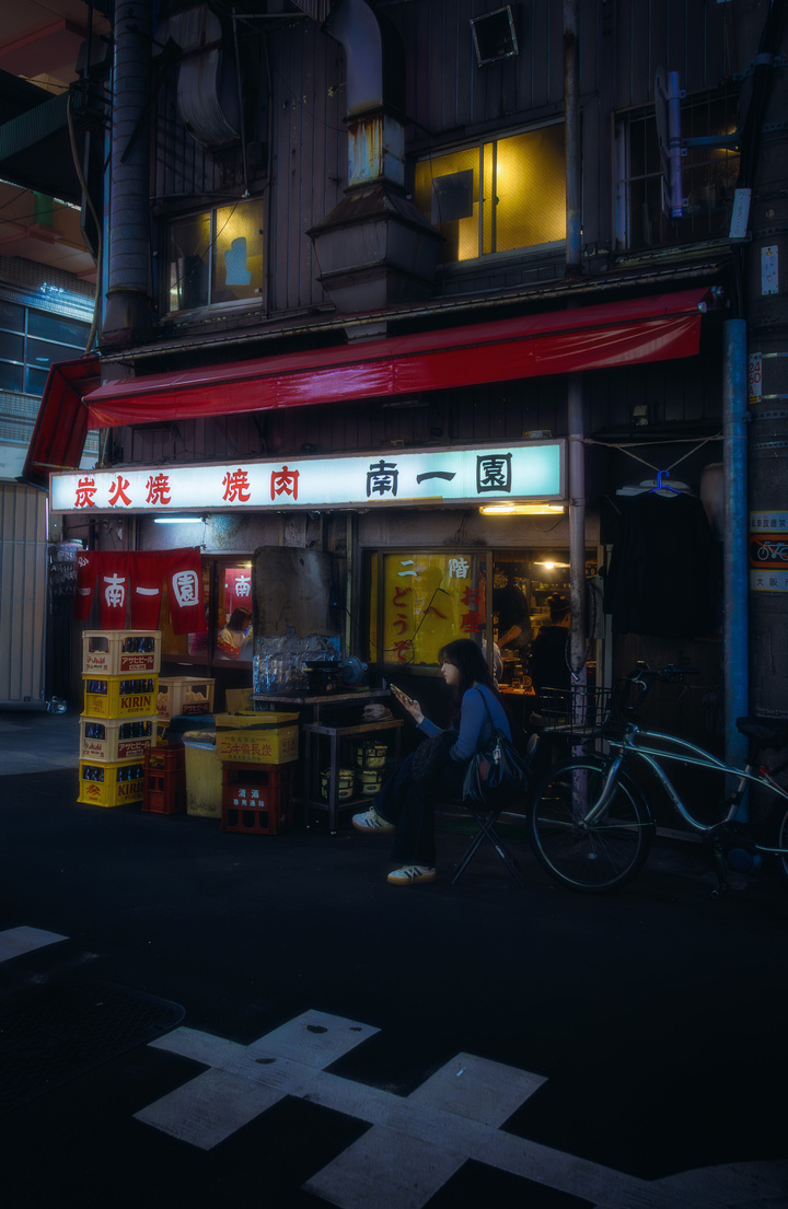 Woman Waiting Outside Yakiniku Bar