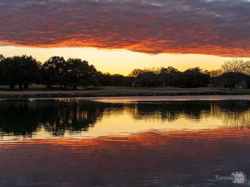 Three-layer sunset over the lake