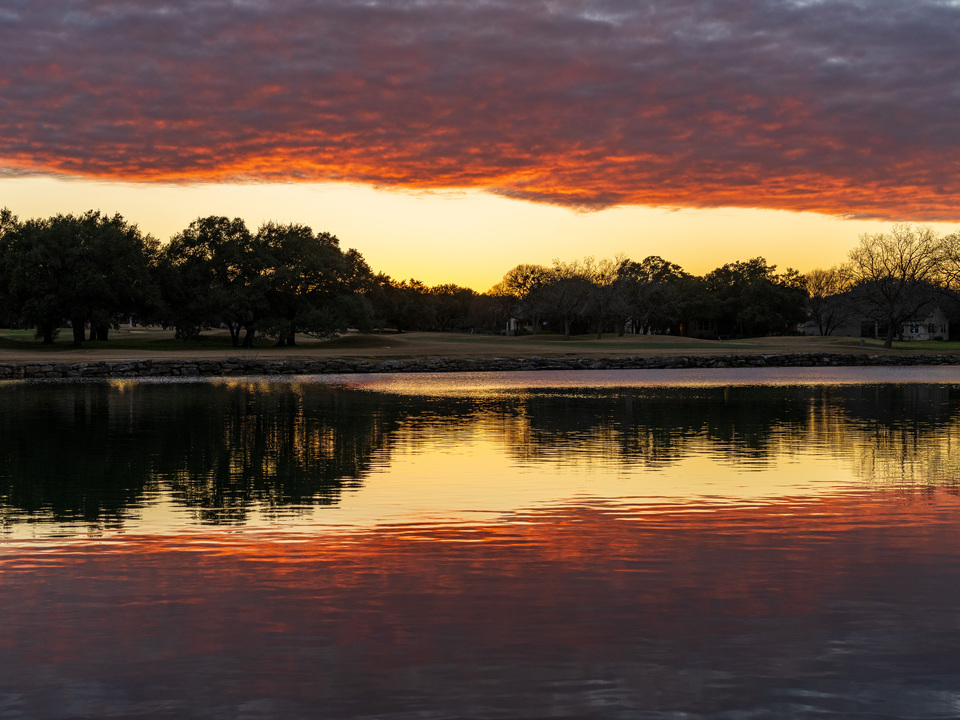 Three-layer sunset over the lake