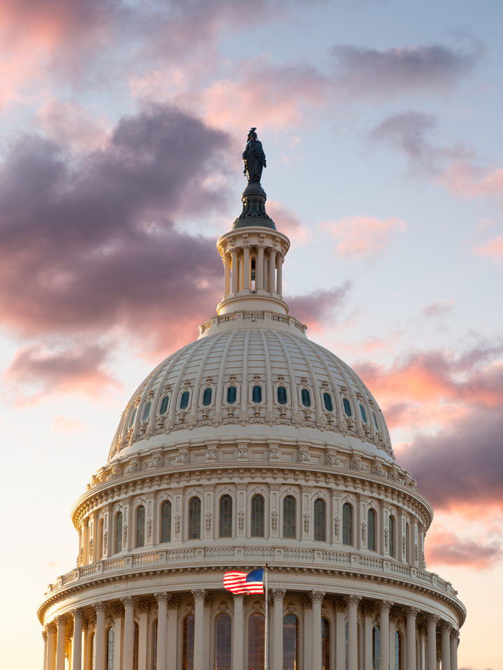 The US Capitol dome as sunrise