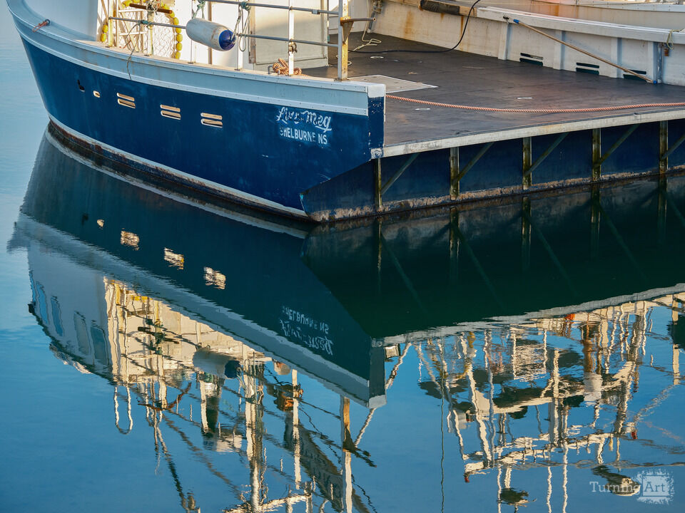 Reflections of a Fishing Boat on Calm Waters