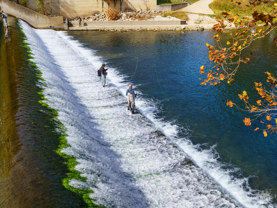 Anglers on a Flowing Stream