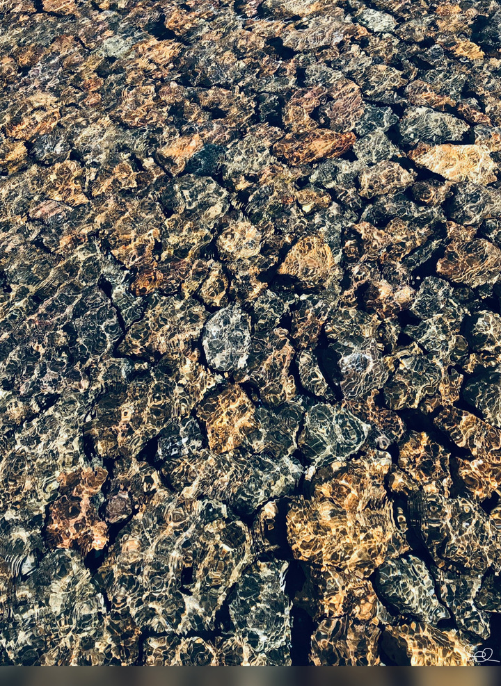 Patterns Of Light Reflecting On River Water