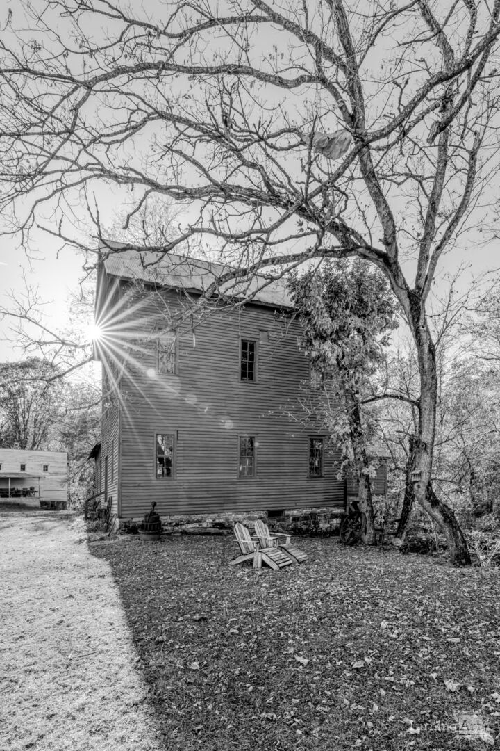 Seating Beside Topaz Mill Vertical Grayscale