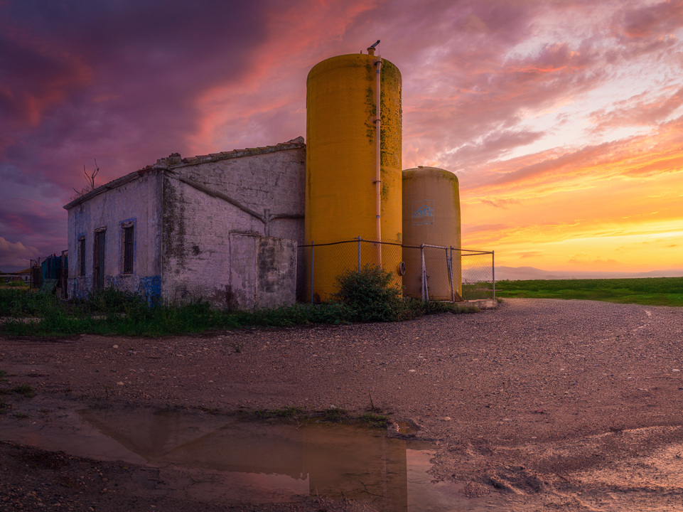 Old farmhouse at sunset in Delta del Ebro