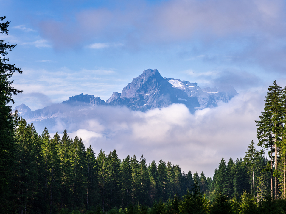 Whitehorse Mountain appears through the clouds