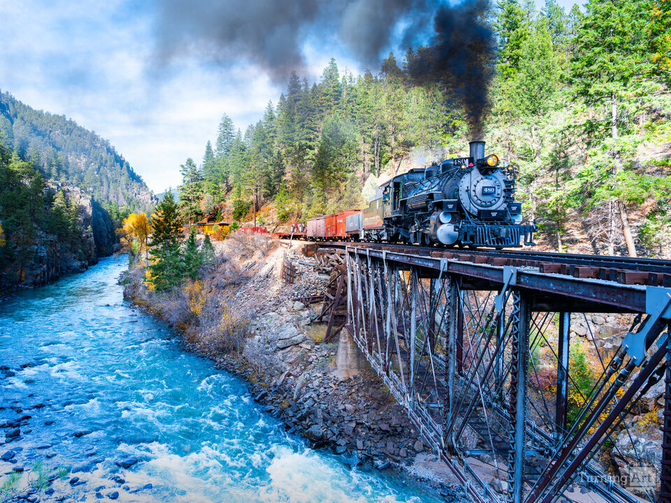 Steam Locomotive crosses trestle above Animus R.