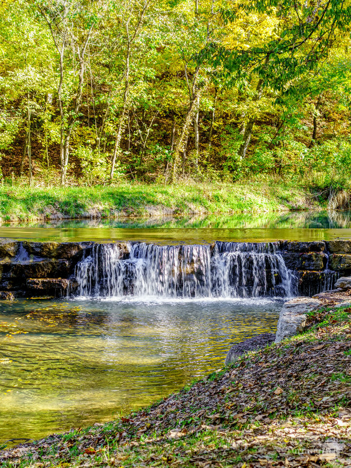 Flowing Waterfall On A Autumn Day