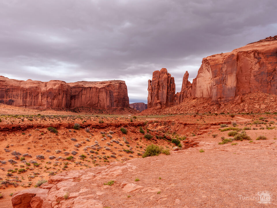 Monument Valley Mesas Under Stormy Sky