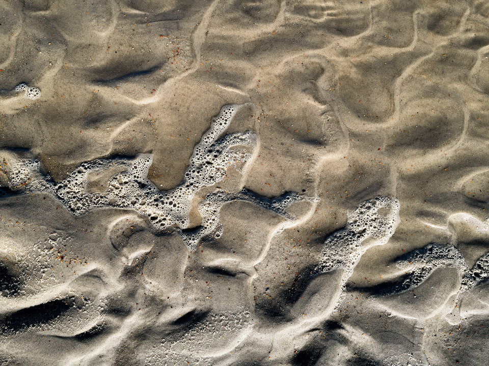 Ebb and Flow of the Ocean and the Sand