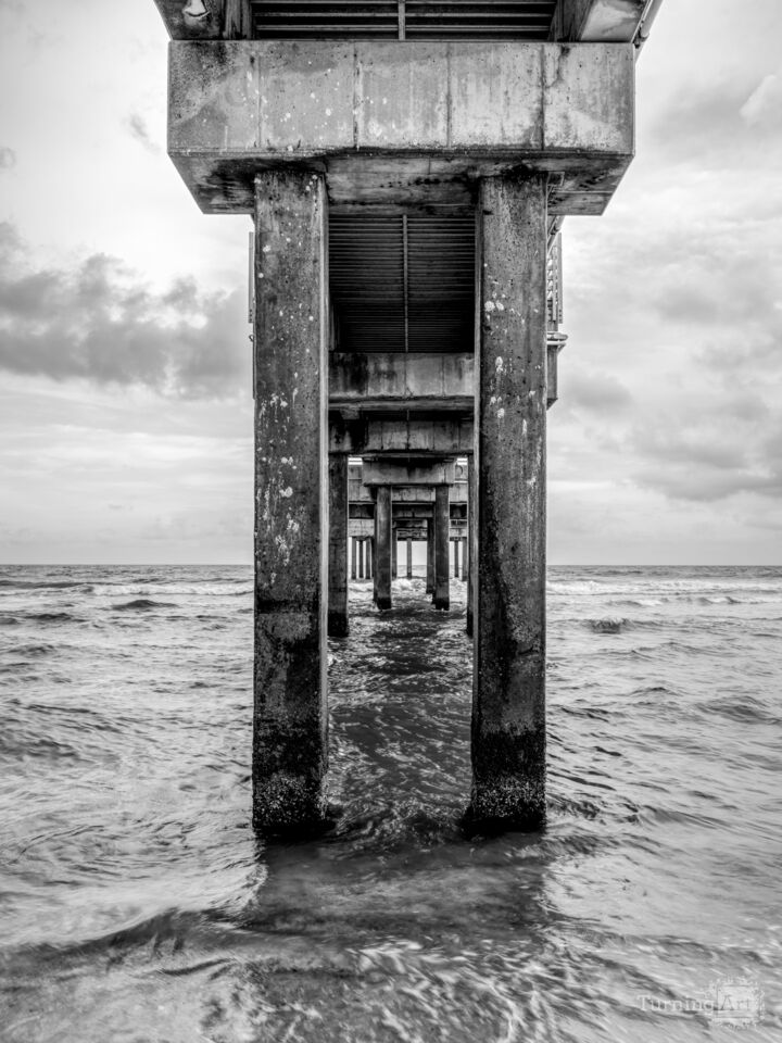 Under Middle Of Orange Beach Pier Grayscale
