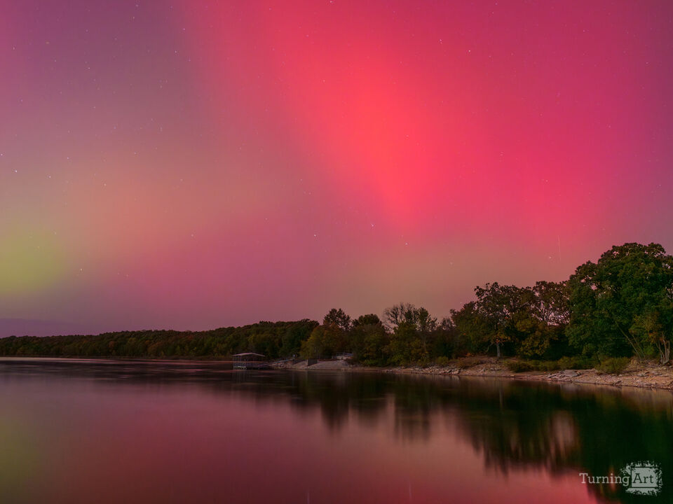 Dancing Skies Over Still Water