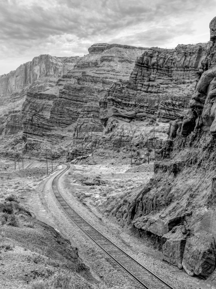 Railroad Tracks Along Utah Cliffs Grayscale