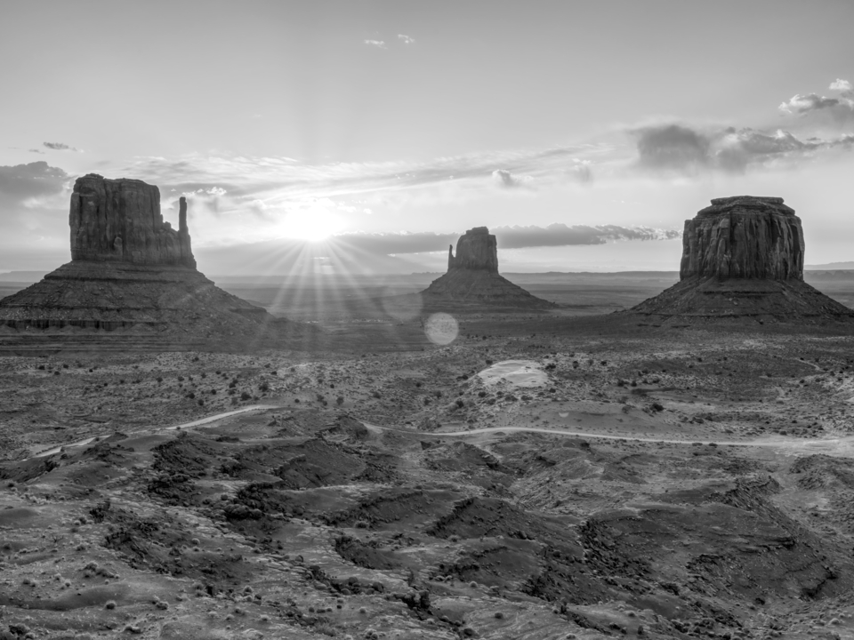 Sunrise Sun Flare Over Monument Valley Grayscale