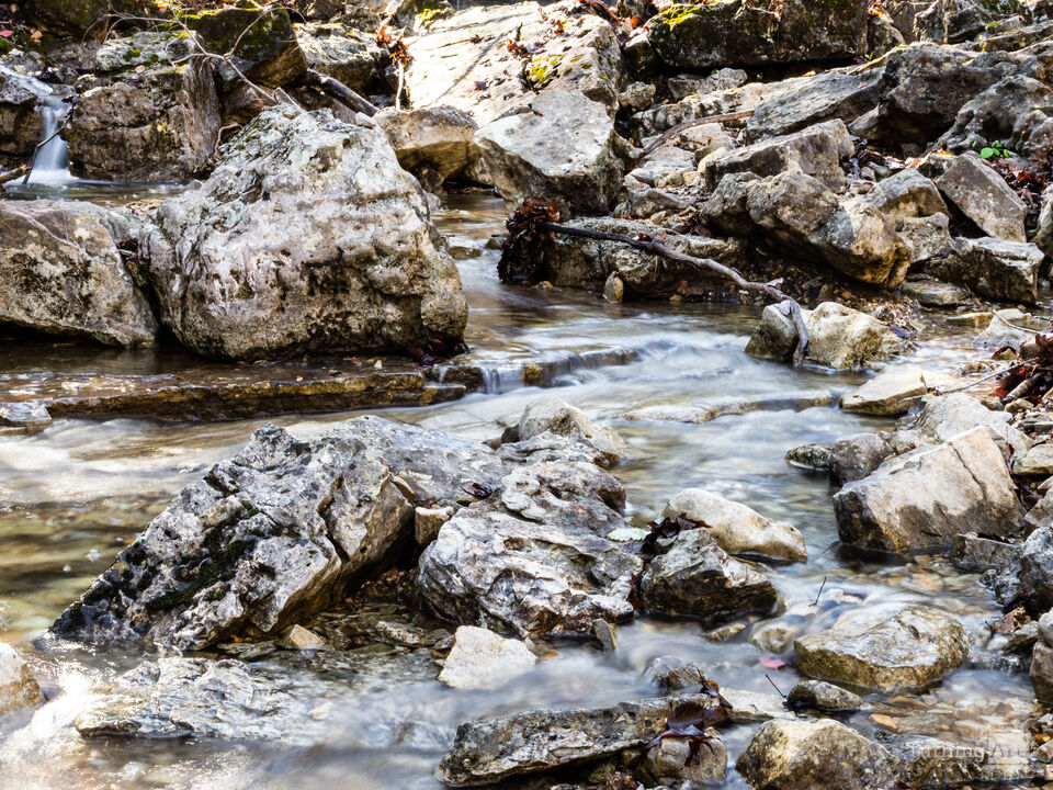 Flowing Waters Through A Rocky Creek
