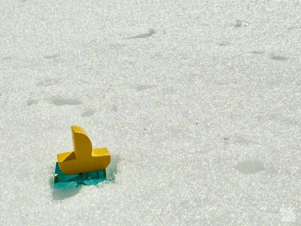 Toy Sailboat in Snow