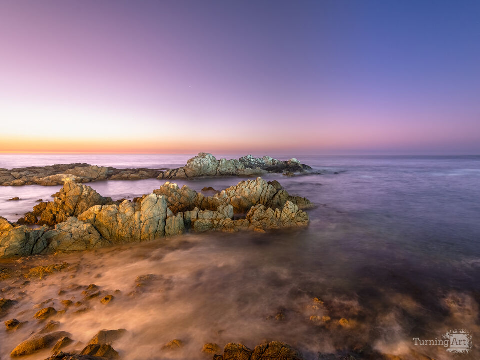 Dusk over the rocky coastal edge